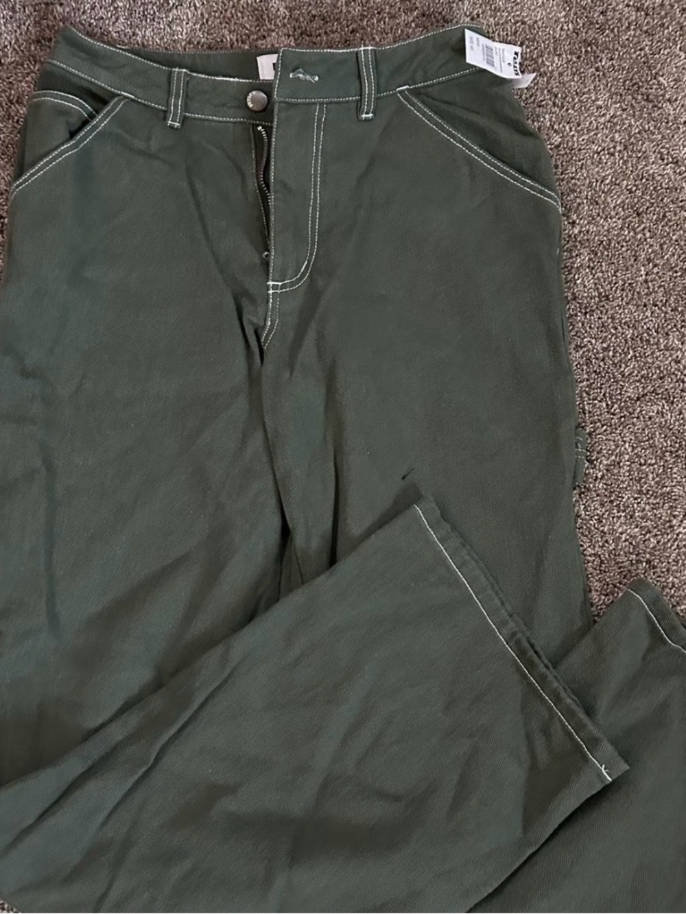 Women’s olive green Tilly’s pants denim texture white stitching